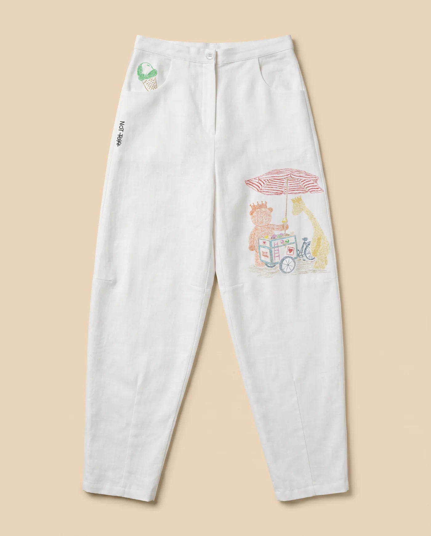 White Not Toys pants with illustrated summer cart artwork